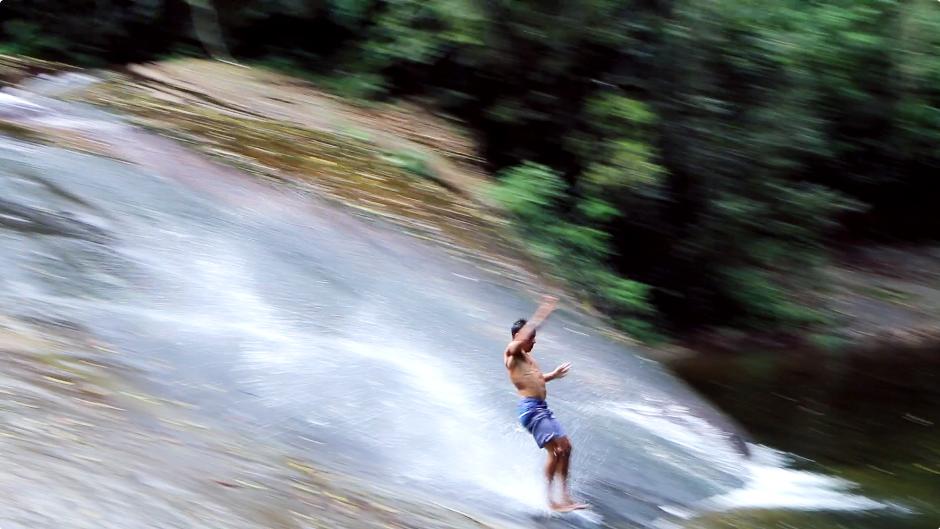 sliding-down-parati-rockface-waterfall