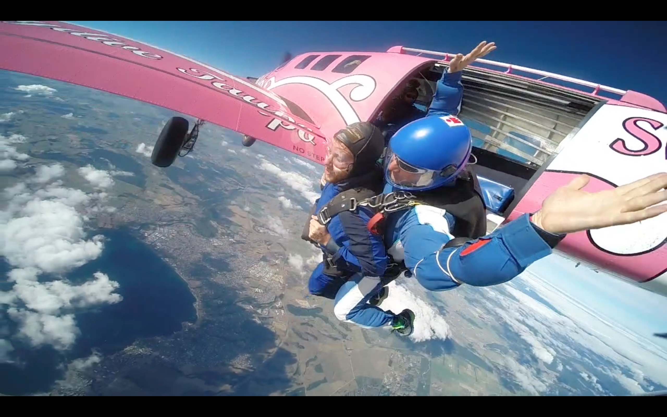 Alex Skydiving over Taupo New Zealand - Kiwi Experience Bus