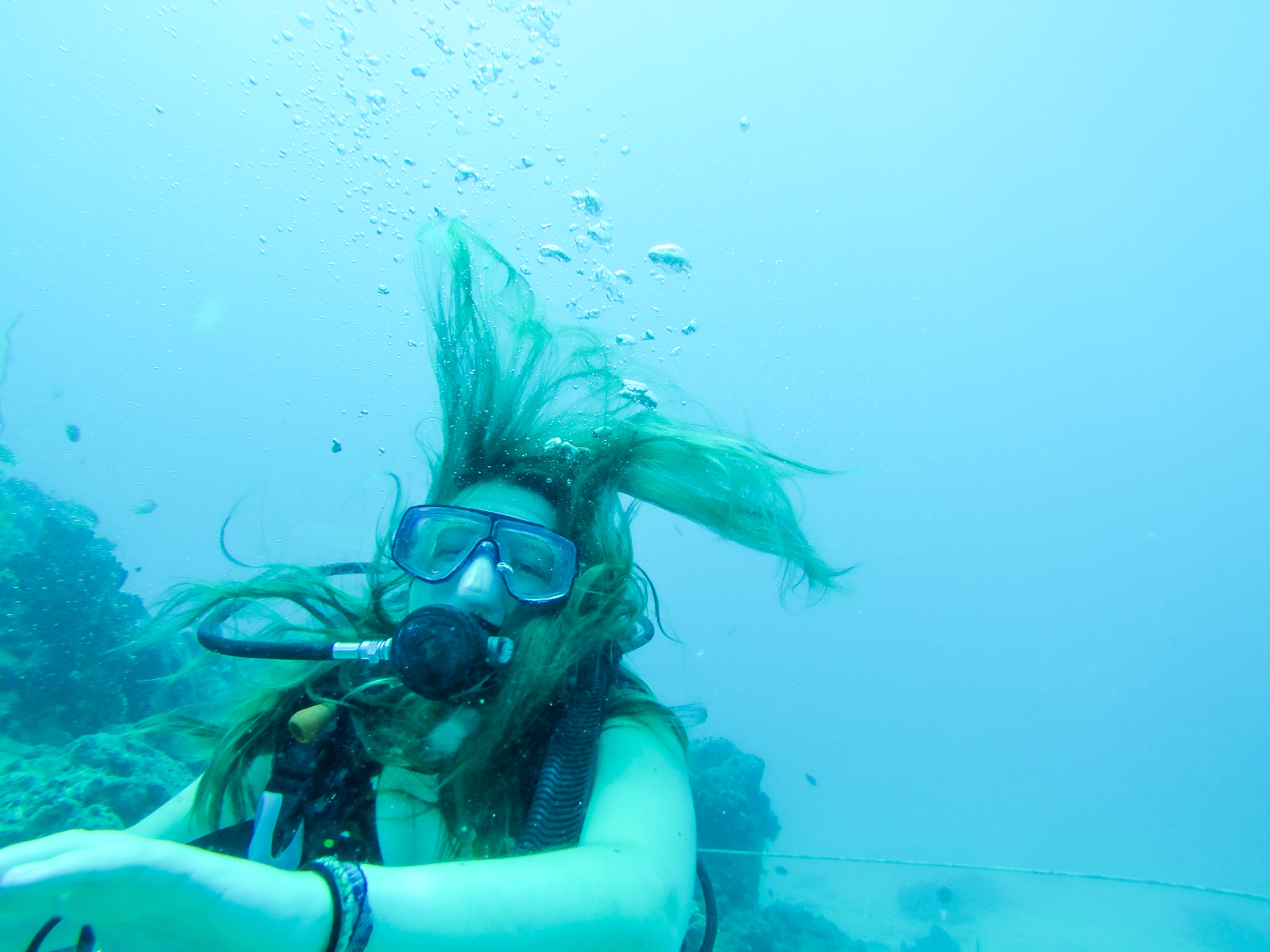 Alis laughing underwater diving waters of South Sea Island, Fiji