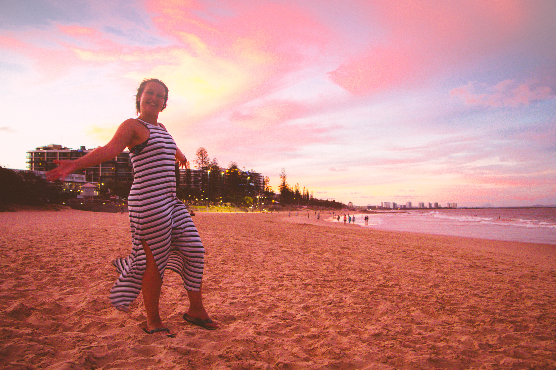 Alis enjoying sunset on a lush golden beach