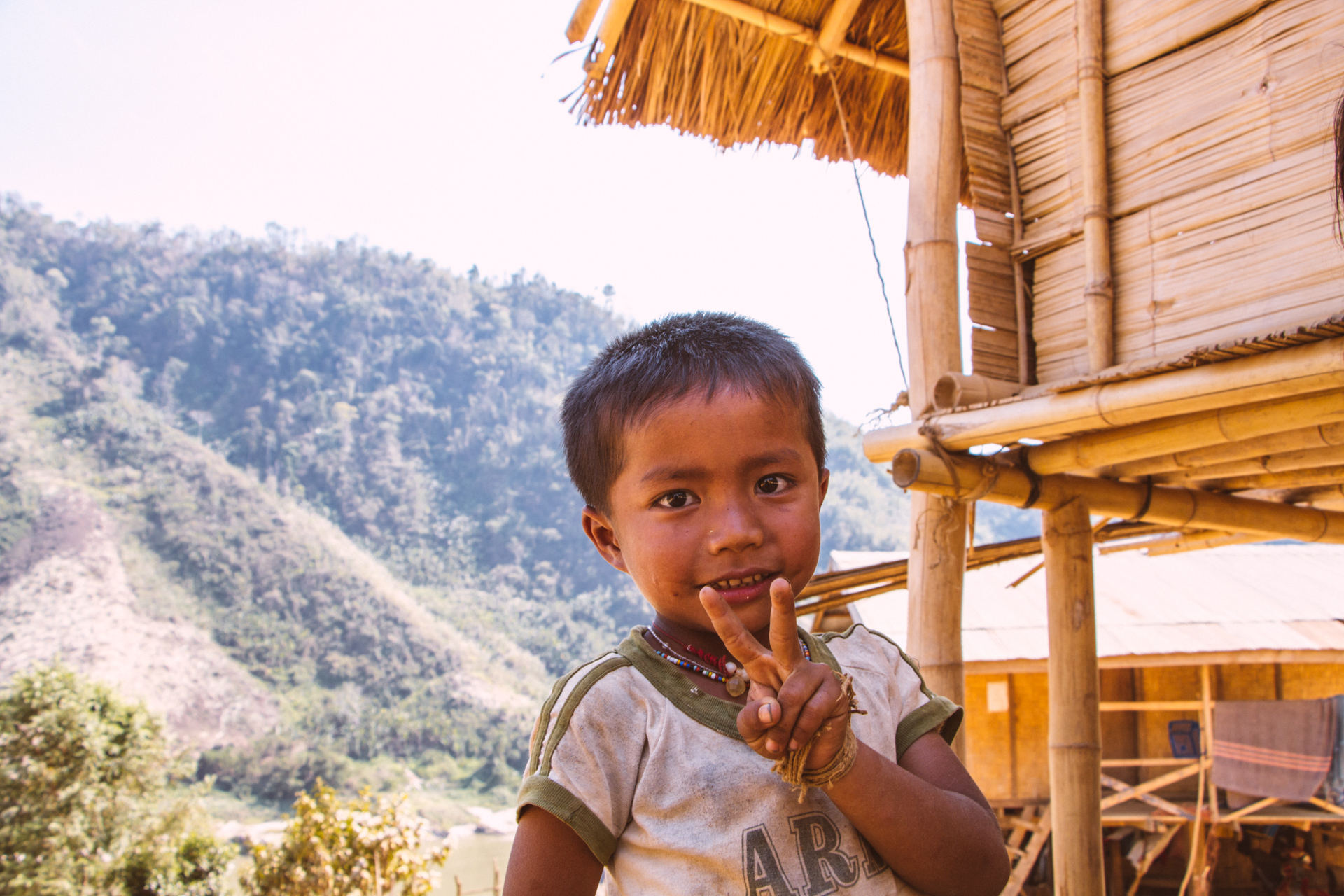 Local Village boy from Mekong River Peace Sign